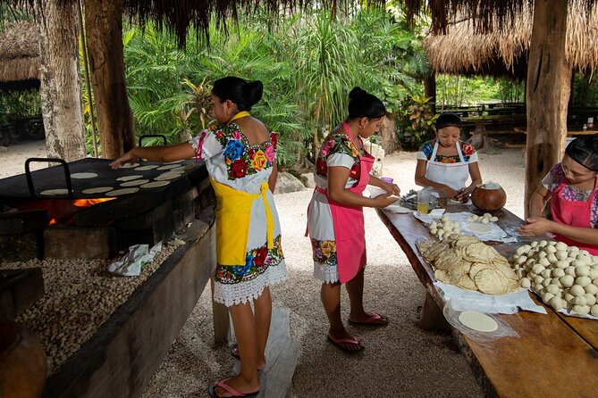 Cenote Tankah and Mayan Village Tour with Zipline, Canoes & Lunch - Canoes on turquoise water: slower than the zipline, still exciting