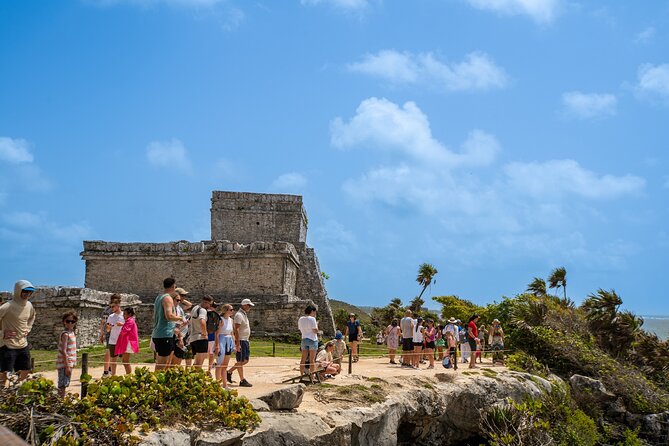 Full Day Tulum Ruins Tour Cenote and Swimming with Sea Turtles - Stop 1: Tulum Ruins on the Cliff Above the Caribbean