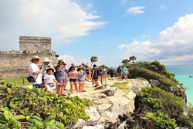 Half-day Excursion to the Mayan Ruins of Tulum, Cenote & lunch - Stop 1: Tulum Archaeological Site, cliff views and guided timing