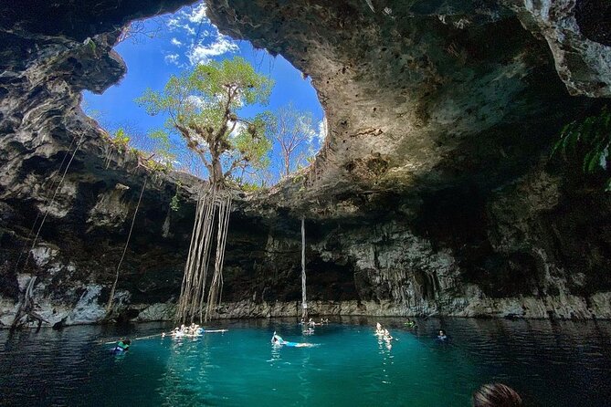 Hubiku & Ikkil Cenote, Valladolid and Chichen Itza! Deluxe From Playa Del Carmen - Valladolid: underground cenote, light from above, and the buffet stop