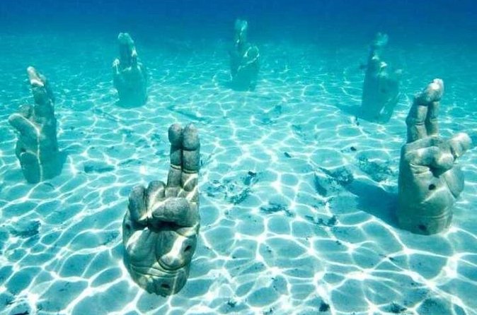 Isla Mujeres on luxury catamaran with snorkel, open bar and lunch - The Small-Group Advantage (Up to 25)