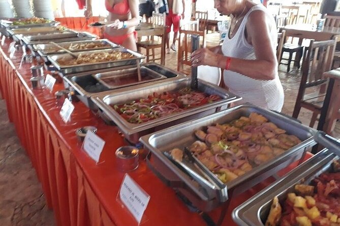 Isla Mujeres Unlimited Catamaran! Drinks, Fun & Party From Playa Del Carmen - Isla Mujeres beach club: loungers, buffet, and more drinks